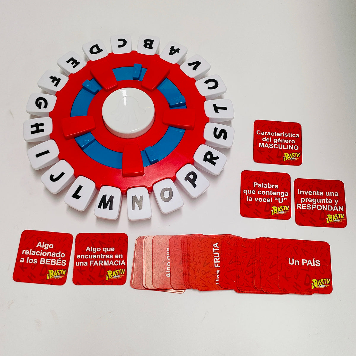 A red and blue circular word game board with letters arranged around the edge, and several red cards.