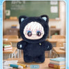 A dark blue cat plush doll pendant blind box with white hair and glasses sitting on a wooden table.