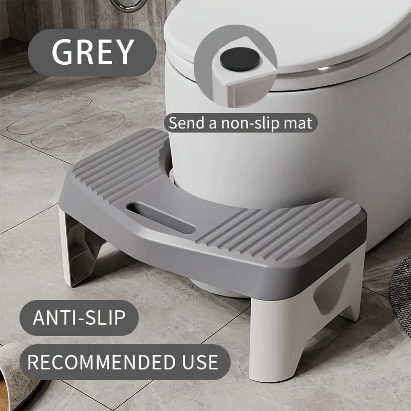 A grey comfort squatting stool with an anti-slip tray is shown next to a toilet.