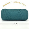 A skein of teal green thick polyester blend yarn coiled for knitting and crochet projects.