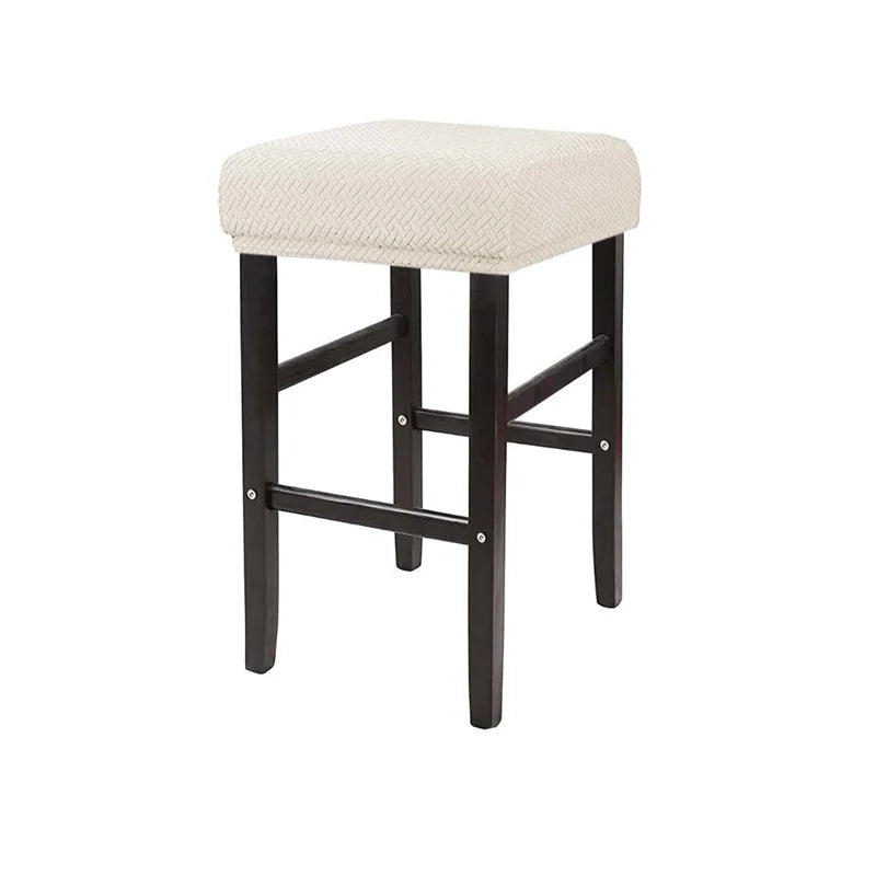 A beige upholstered bar stool featuring a woven fabric seat and dark wooden legs.