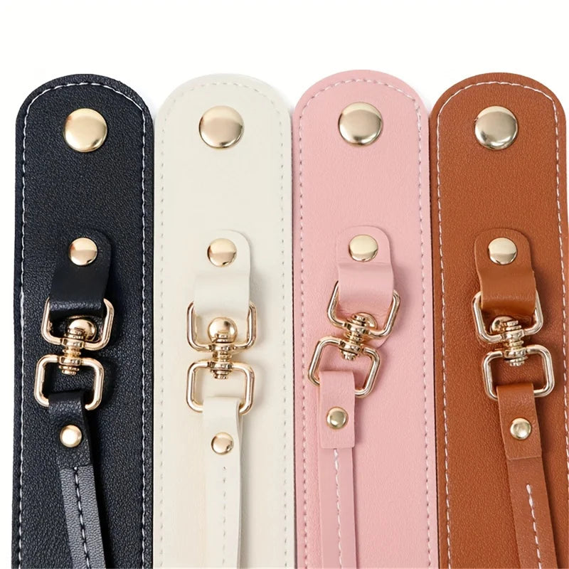 Ein Set aus vier Vintage-Lederhandschuhriemen und Handtuchhalter in Schwarz, Creme, Pink und Braun.