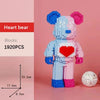 A pink and blue LEGO-style bear figure built from 1920 pieces with a red heart detail.