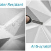 Close-up view of a white decorative 3D diamond texture wall panel, showing water resistance and anti-scratch properties.