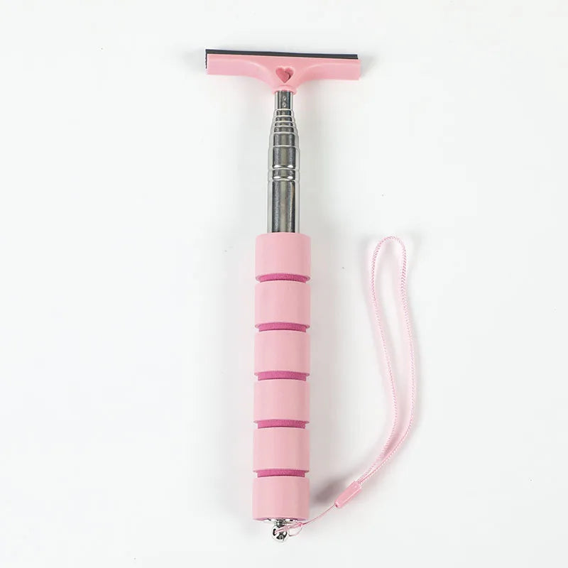 A pink retractable car mirror and window cleaning wiper with a silver handle and pink cord.