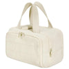 A cream-colored travel makeup bag with a wide opening and carrying straps.