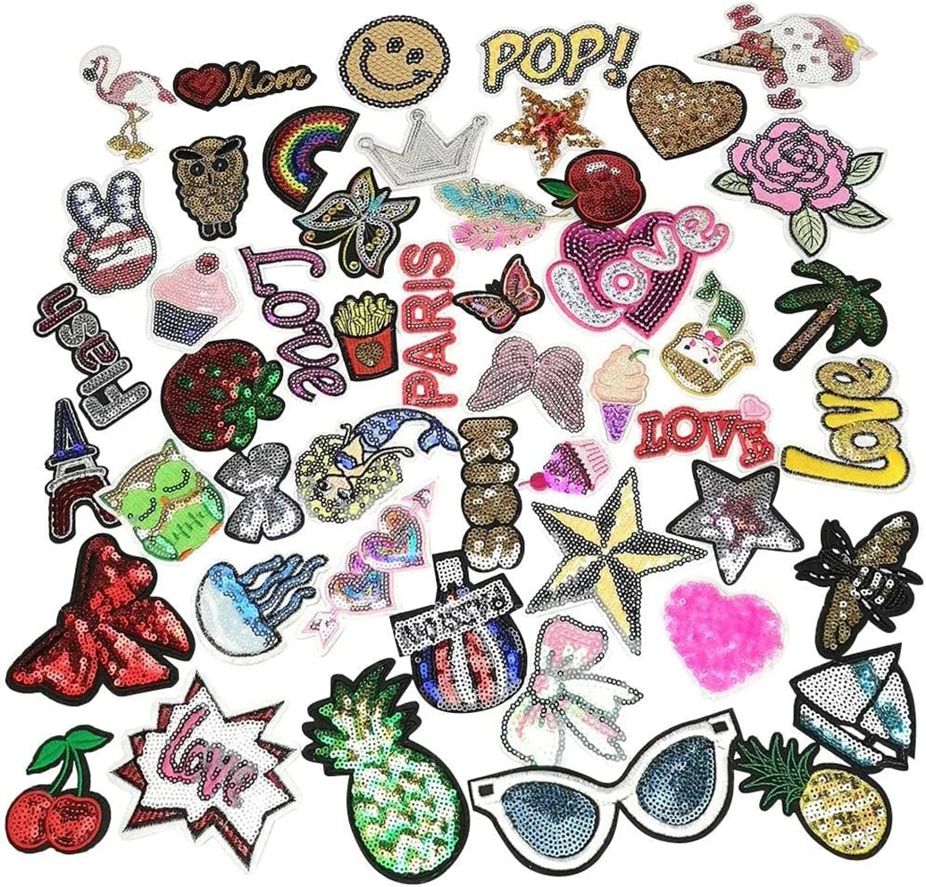 A collection of 30 assorted embroidered iron-on patches featuring various designs like hearts, stars, and text.