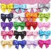 A collection of five colorful sequin bow patches in various colors and patterns for DIY crafts.