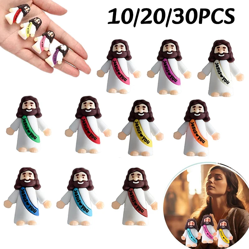 A set of mini Jesus figurines with beards and robes in white, black, and purple colors for Easter or religious celebrations.