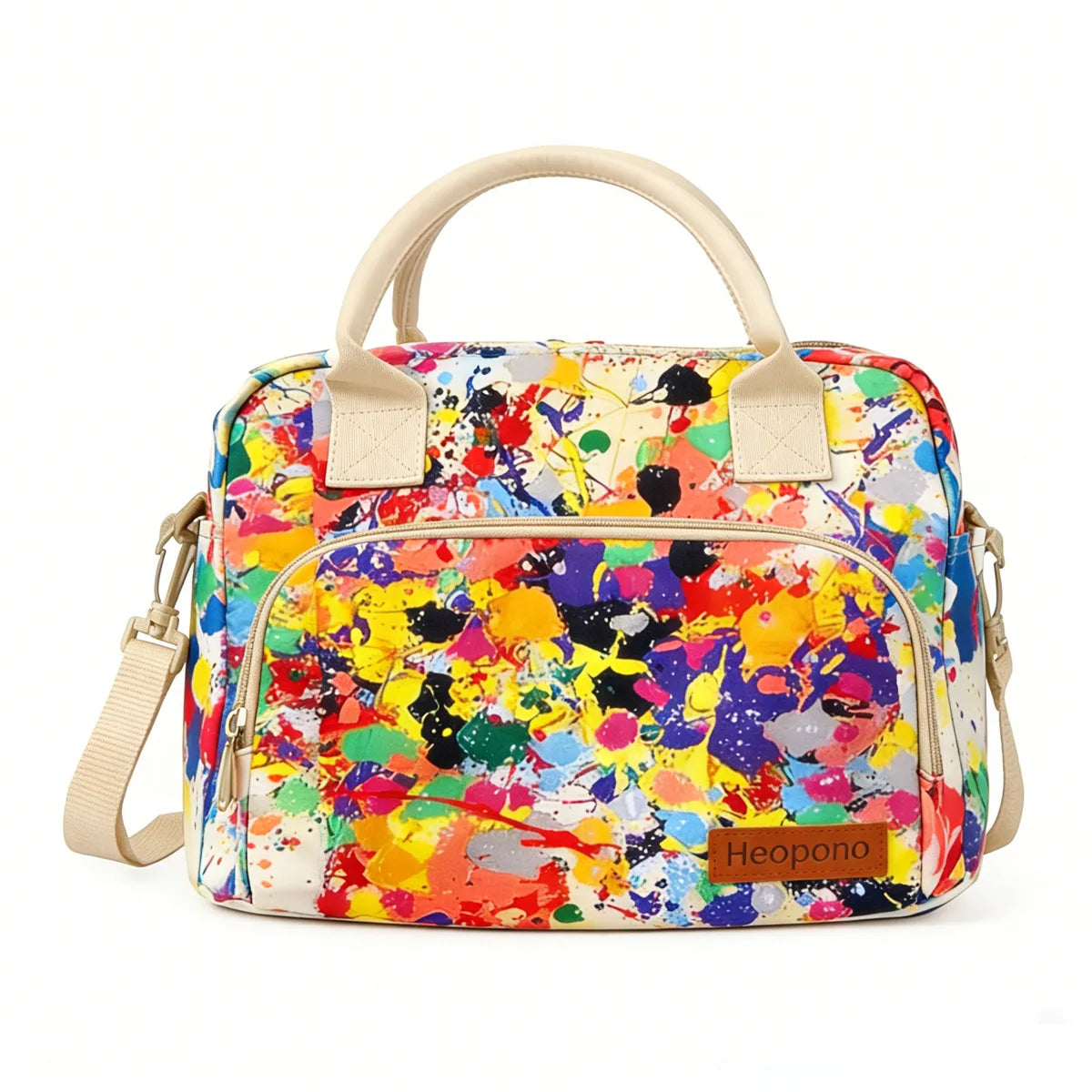 A colorful, abstractly painted insulated picnic lunch bag with light beige straps.
