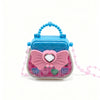 A pink and blue cosmetic playset featuring a butterfly-shaped case with a handle and pink beaded strap.