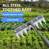 A close-up view of an all steel toothed rake with a double layered tooth design resting on green garden foliage.