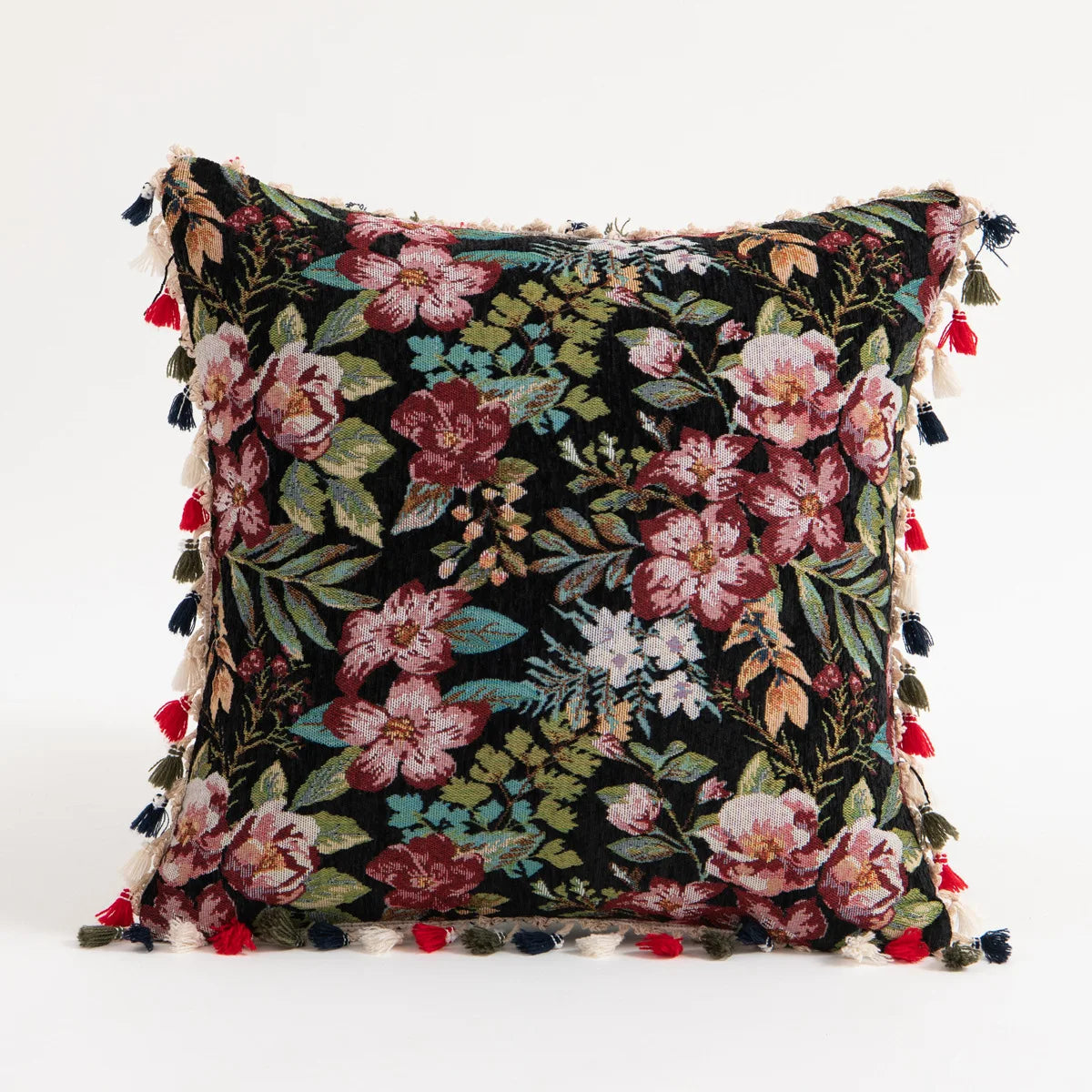 A dark floral print throw pillow cover featuring pink and burgundy flowers with fringed tassels.