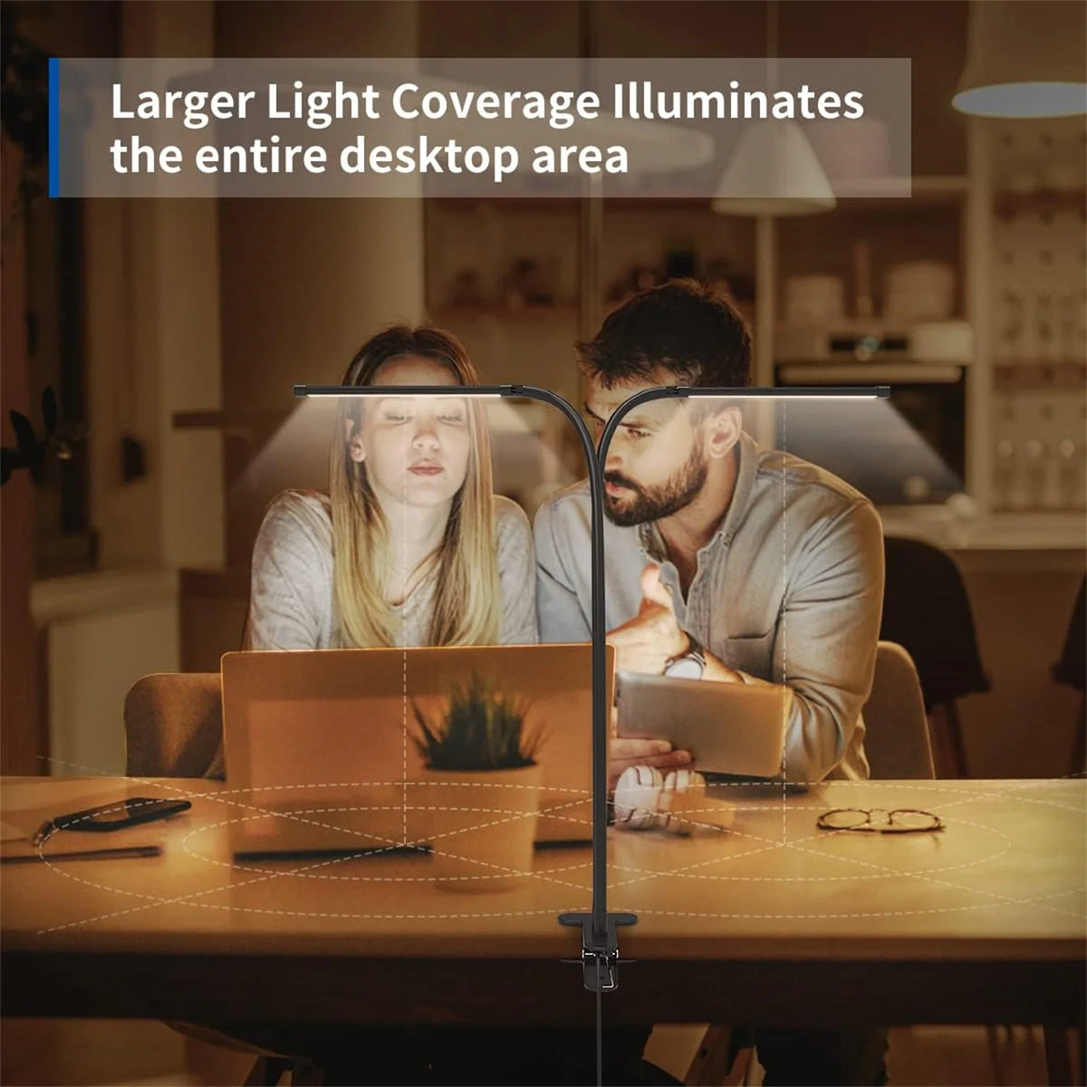 A woman and a man are working at a desk illuminated by a light bar that covers the entire desktop area.