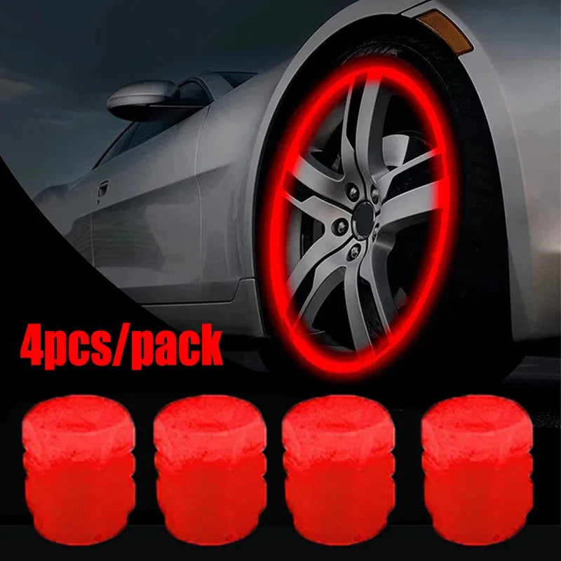 Four luminous red tire valve caps are shown next to a car wheel for sale.