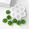 A white silicone mold set with five flower shapes for making 3D succulent flowers.