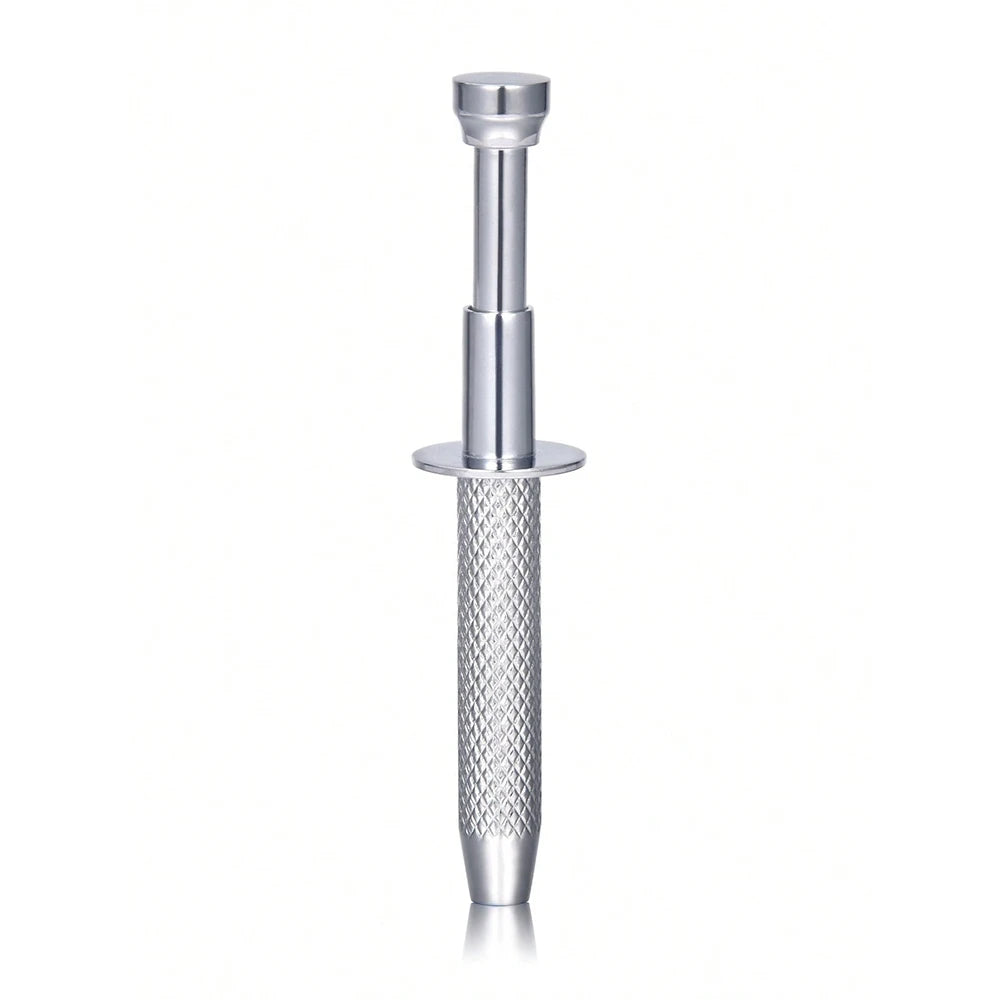 A stainless steel piercing ball grabber tool with a cylindrical handle and a textured grip.
