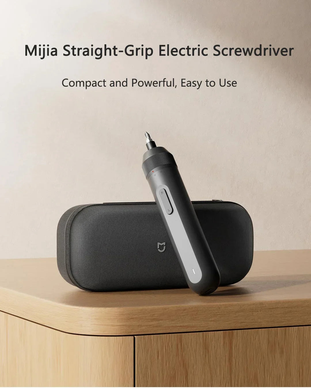 A black Mijia Straight-Grip electric screwdriver is shown resting on a wooden surface.