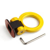 A gold-colored sporty trailer hook decorative accent for cars.