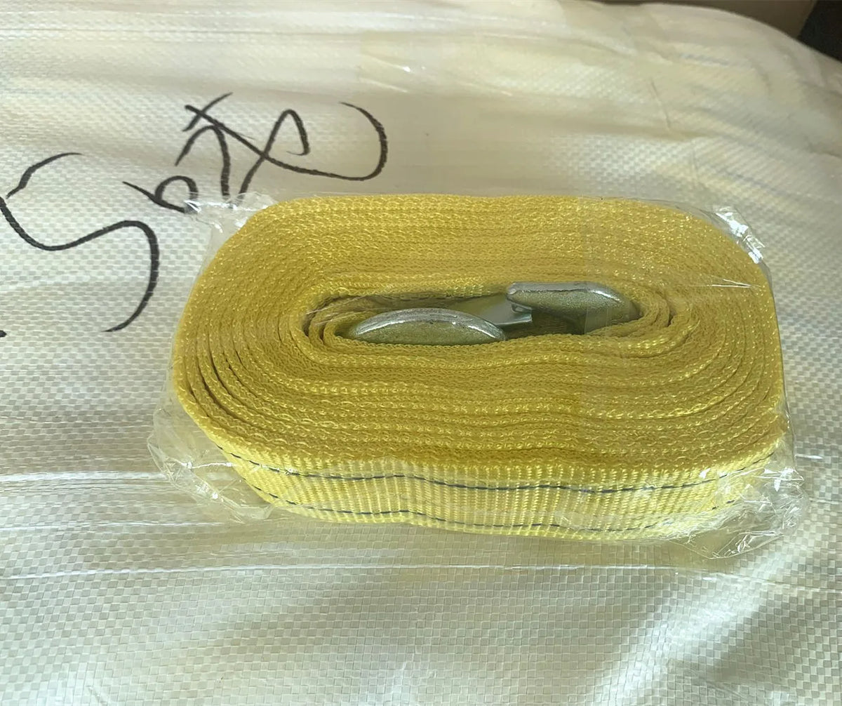 A roll of yellow heavy-duty vehicle recovery towing strap packaged in clear plastic.