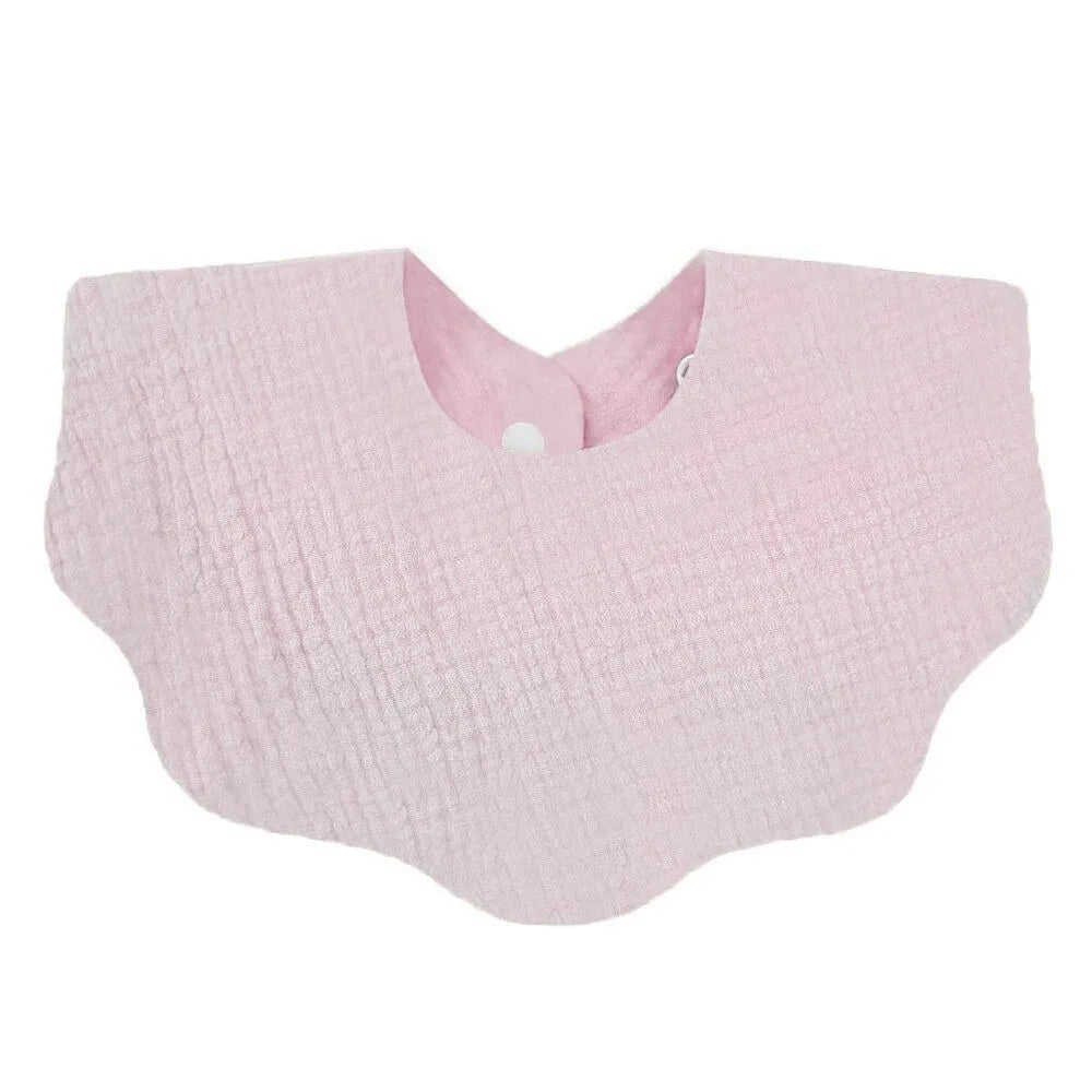 A light pink, textured cotton baby bib in a bandana style for newborns.