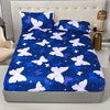 A royal blue fitted bed sheet with a white and purple butterfly pattern displayed on a bed.
