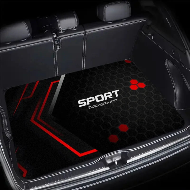A black and red patterned car trunk mat is shown inside a vehicle, highlighting its design.