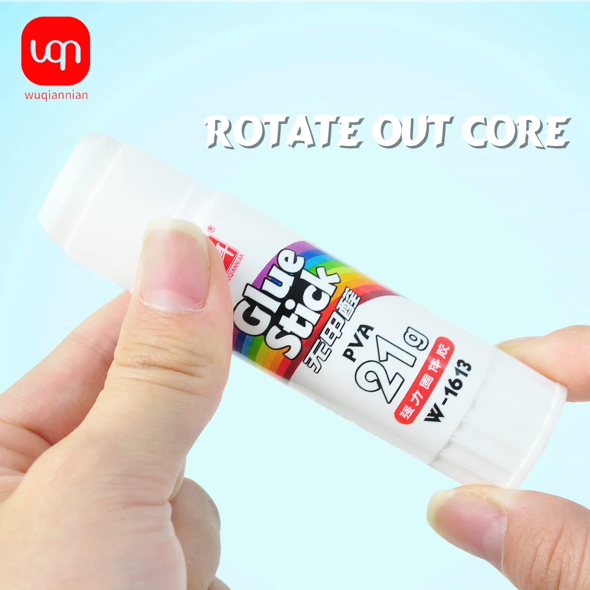 A hand is holding a white glue stick with colorful packaging, labeled PVA 21g W-1613, ready for use.