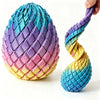 A hand twists a colorful, striped egg stress reliever made of plastic.