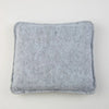 A square, gray needle felting mat made of wool for crafting.