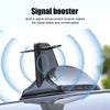 A close-up of a Shark Fin car antenna signal booster device mounted on a vehicle's roof.