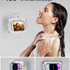 A woman is using a waterproof shower phone holder with 480° rotating design to take a picture.