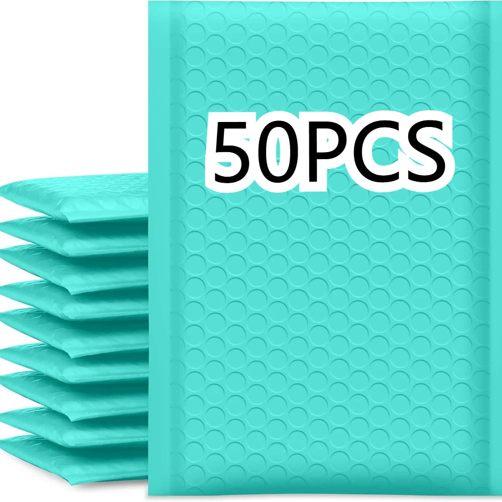 A stack of teal bubble mailers with a 50PCS label on the packaging.