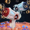 A white electric bubble gun is firing bubbles toward a dark background, surrounded by floating spheres.