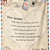 A cream colored fleece throw blanket with a heart design and text expressing love to grandma