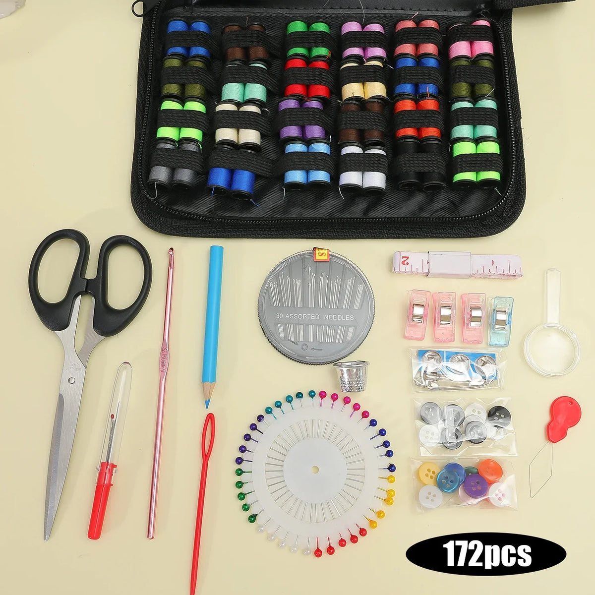A compact portable sewing kit showing various hand sewing tools including scissors needles pins and a wheel