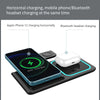 A charging station horizontally charges an iPhone and a Bluetooth headset simultaneously.
