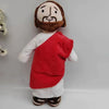 A plush doll depicting a bearded man with a brown hair and a red garment.
