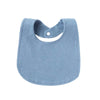 A light blue soft cotton baby bib with a cutout for the neck and a small button closure.