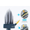 A dark blue floor scrub brush with bristles and a squeegee attached, shown with close-ups of the brush head.