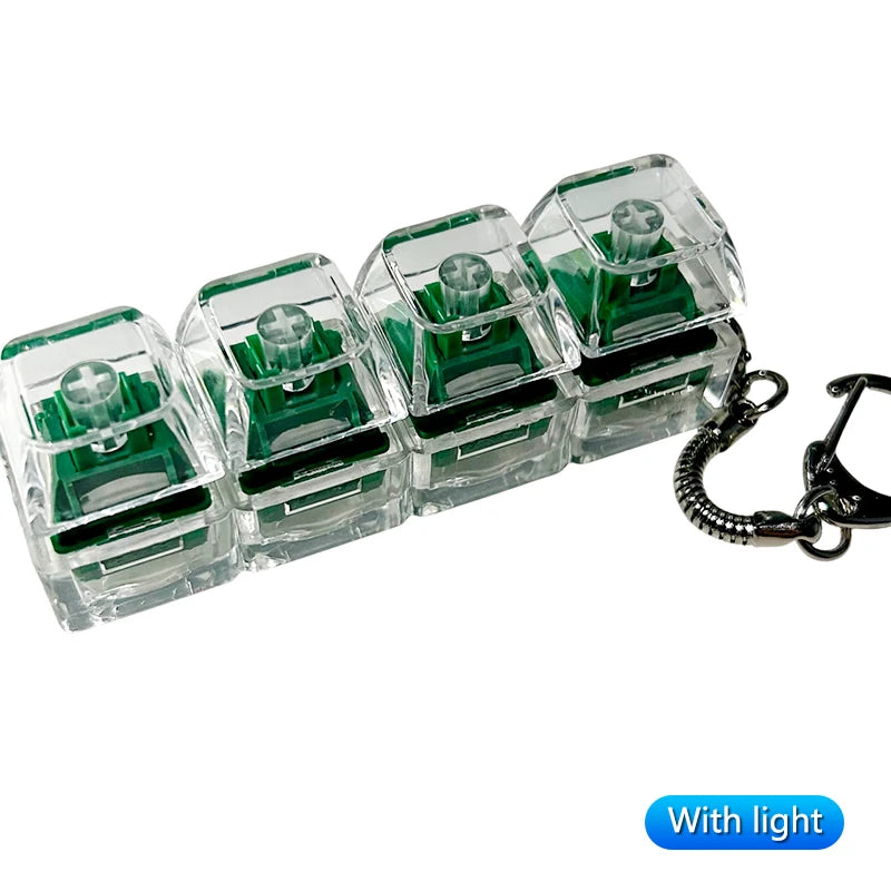 A set of clear plastic LED mechanical keychain fidget toys with custom green keycaps and metal clasps.