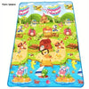 A colorful play mat featuring farm animal designs for baby play.
