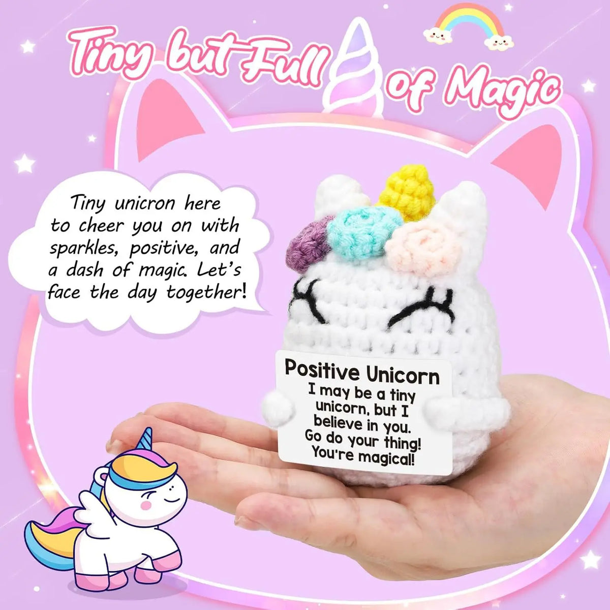 A white crocheted unicorn doll is held in a hand, surrounded by sparkles and text wishing positivity.