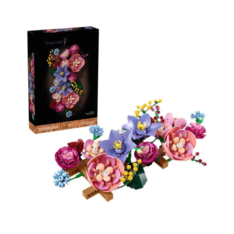 A box of Botanical Blooms building blocks featuring artificial flowers in various shades of pink, purple, and blue.