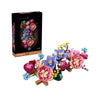 A box of Botanical Blooms building blocks featuring artificial flowers in various shades of pink, purple, and blue.