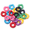 A collection of colorful acrylic spacer beads in a wave pattern, including pink, blue, green, and yellow.