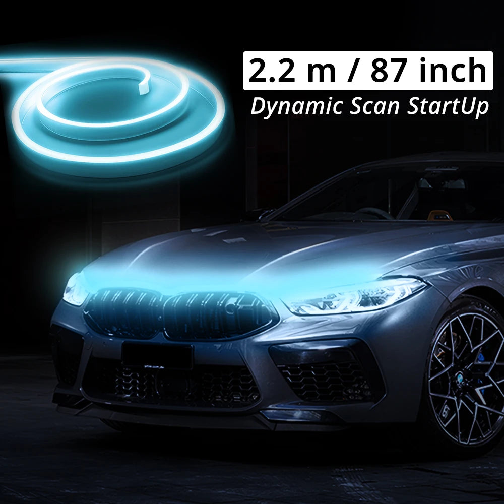 A close-up of a car's front grille and hood with a bright blue LED light strip effect.