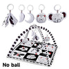 A baby play gym mat with various hanging toys including animal shapes and fabric pieces.
