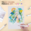 A hand holds an alcohol marker drawing a girl with vibrant colors on white paper surrounded by various art supplies.