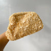 A close-up of a light beige sequin beaded chain shoulder clutch bag.